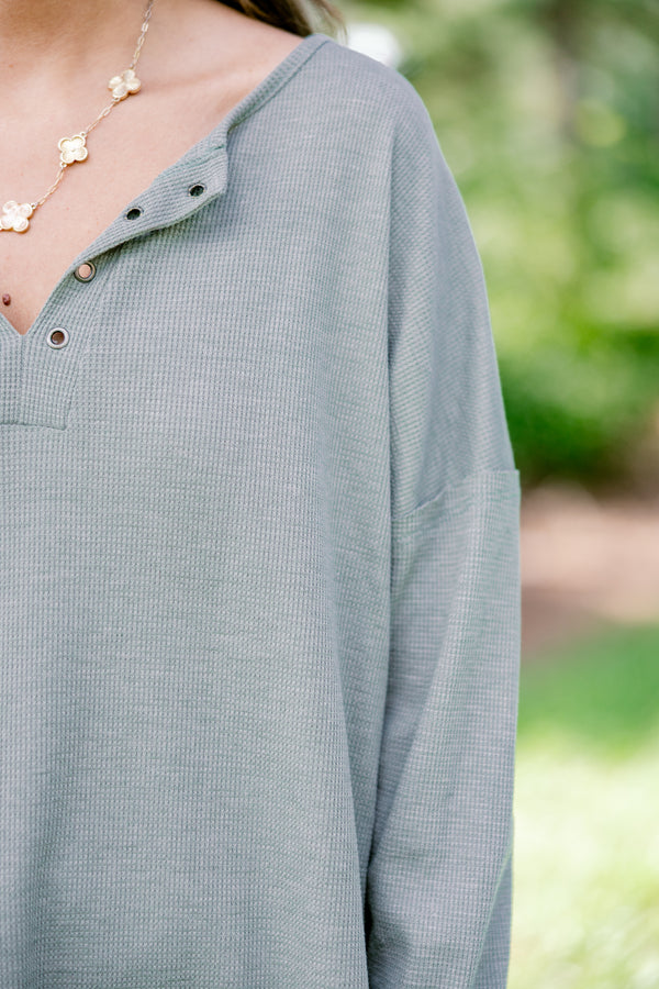 Chic Soul plus size clothing, light olive long sleeve top with scoop hem and buttons 1/4 of the way down the front