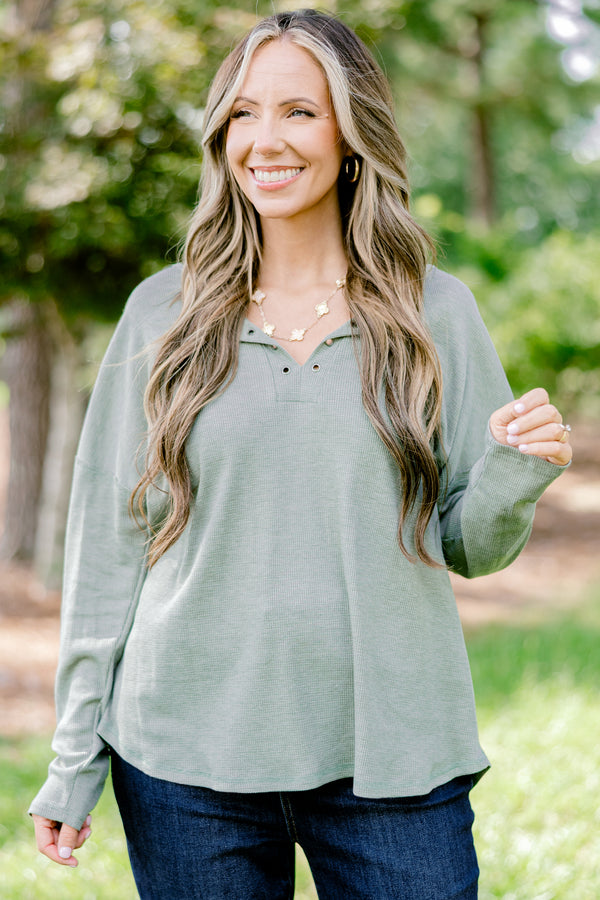 Chic Soul plus size clothing, light olive long sleeve top with scoop hem and buttons 1/4 of the way down the front