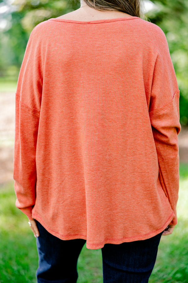 Chic Soul plus size clothing, rust red long sleeve top with buttons ¼ of the way down the top that is relaxed in fit with a scoop hem
