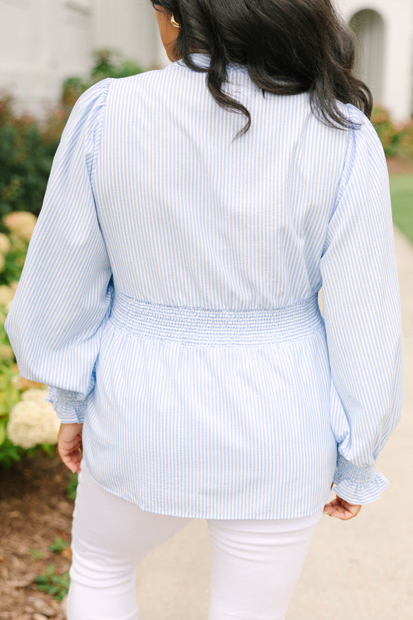Plus Size light blue and white striped blouse with a zippered front and smocked waist.