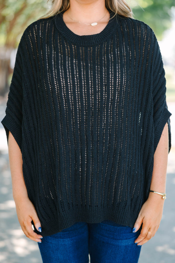 Plus Size black open-knit poncho sweater with a crew neckline and short, wide sleeves.