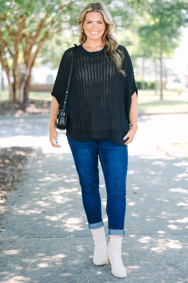 Plus Size black open-knit poncho sweater with a crew neckline and short, wide sleeves.