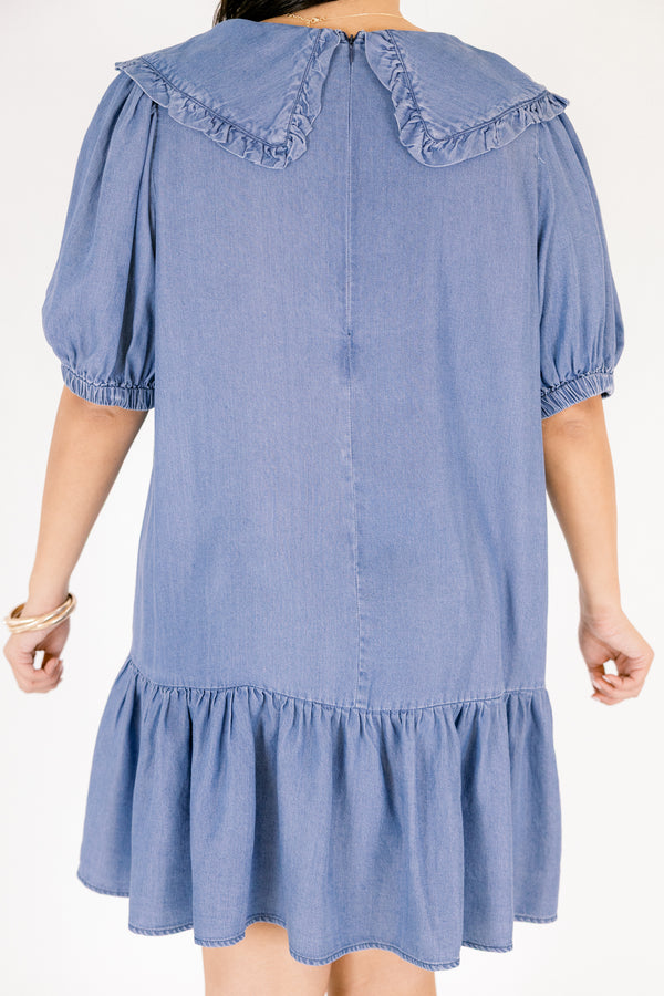 Chic Soul plus size clothing, Denim knee length dress with bubble sleeves and a bib collar that has ruffle detailing going along the edge of the bib as well as a ruffle detail on the bottom tier of the dress 
