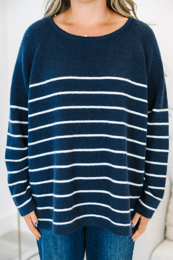 Plus Size navy blue and white horizontal striped sweater with a crew neckline and long sleeves.