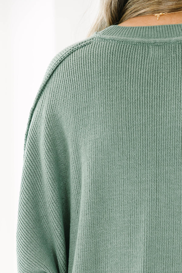 Chic Soul plus size clothing, olive colored sweater regular length, longer on the sides chunky sweater with outward seamlines