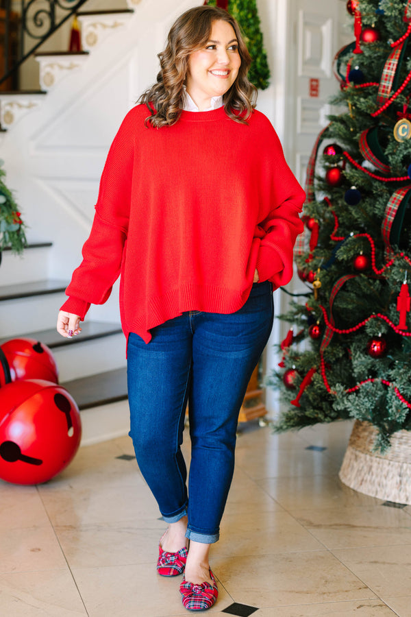 Plus size red oversized knit sweater with a crew neck and relaxed fit.