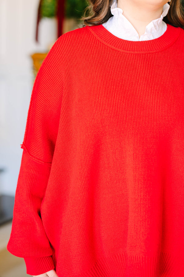 Plus size red oversized knit sweater with a crew neck and relaxed fit.