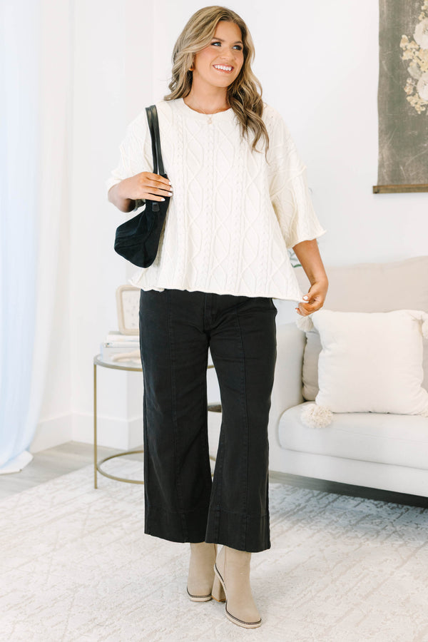 Plus Size black wide-leg jeans with front seam detailing and a cropped hem.