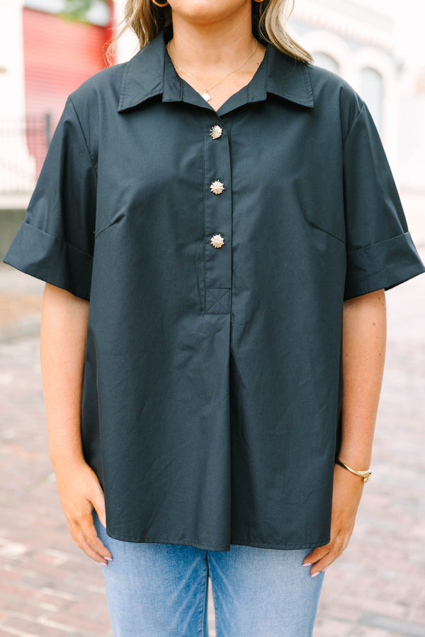 Plus Size black short sleeve top with a collar and gold starburst buttons.