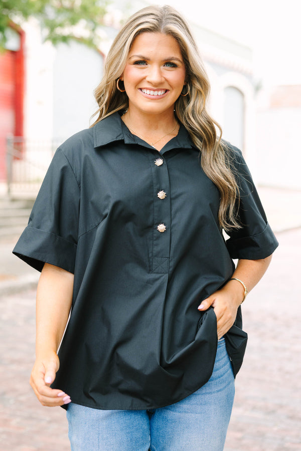 Plus Size black short sleeve top with a collar and gold starburst buttons.