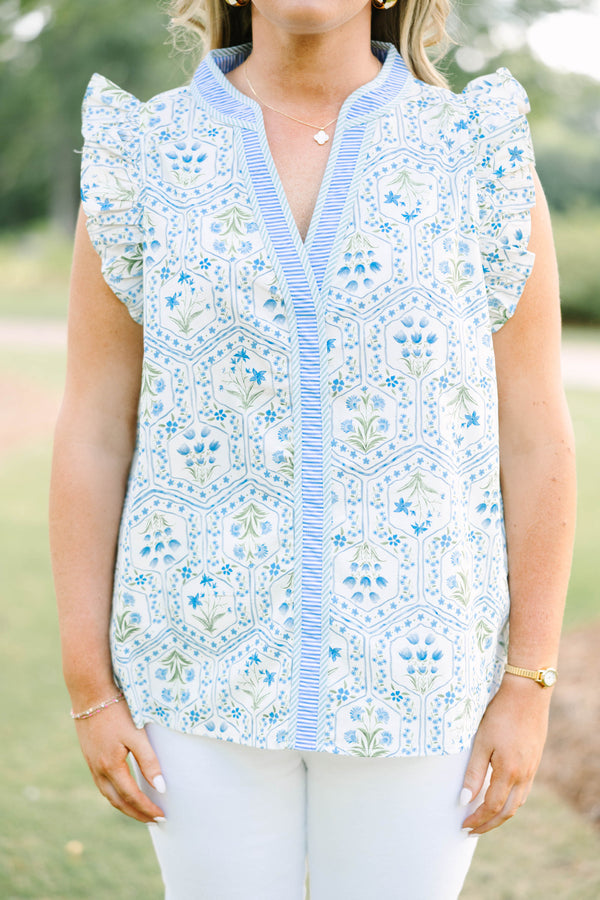Plus Size blue and white floral print top with ruffle cap sleeves and a striped V-neckline.
