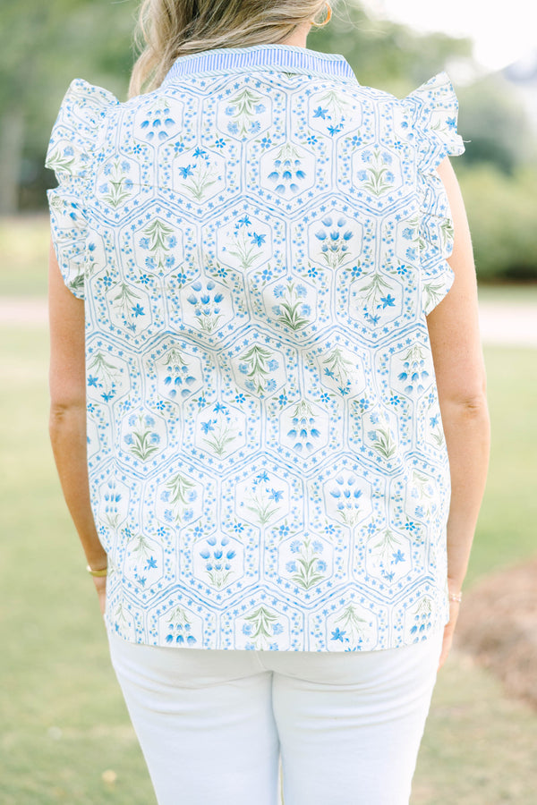 Plus Size blue and white floral print top with ruffle cap sleeves and a striped V-neckline.
