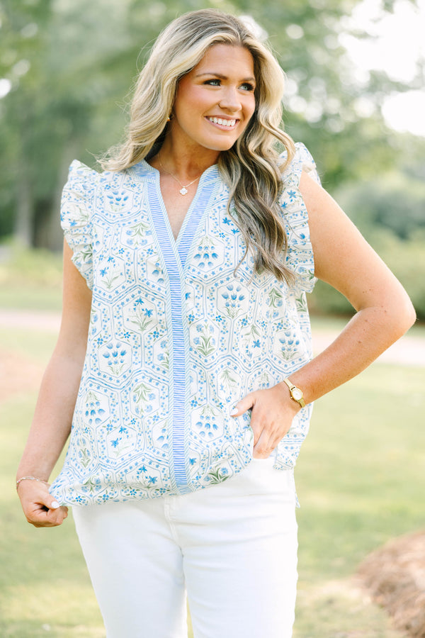 Plus Size blue and white floral print top with ruffle cap sleeves and a striped V-neckline.