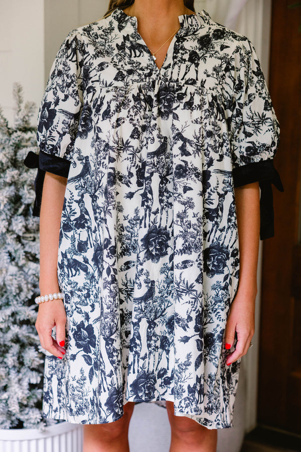 Chic Soul plus size clothing, black and white toile print short tiered puff sleeve dress with a subtle v neckline and black bows on the sleeves