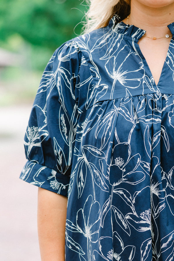 Chic Soul plus size clothing, navy baby doll dress with short sleeves and a white floral pattern throughout 