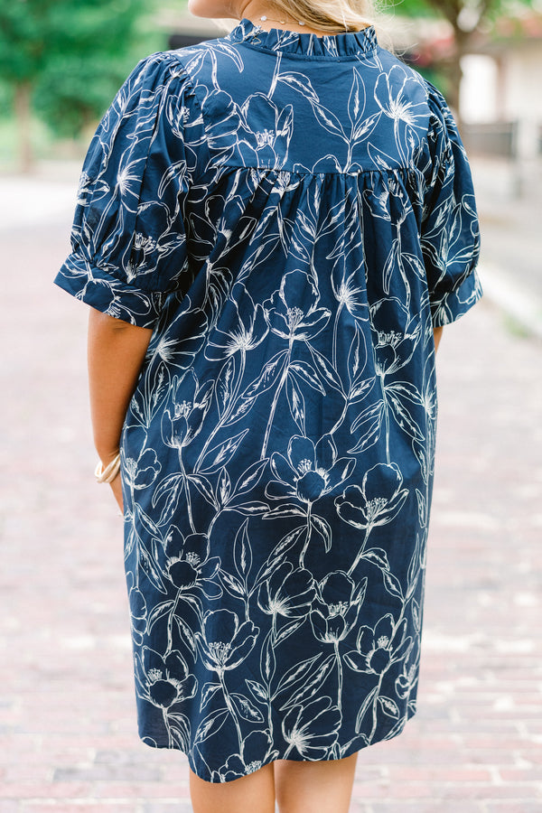 Chic Soul plus size clothing, navy baby doll dress with short sleeves and a white floral pattern throughout 