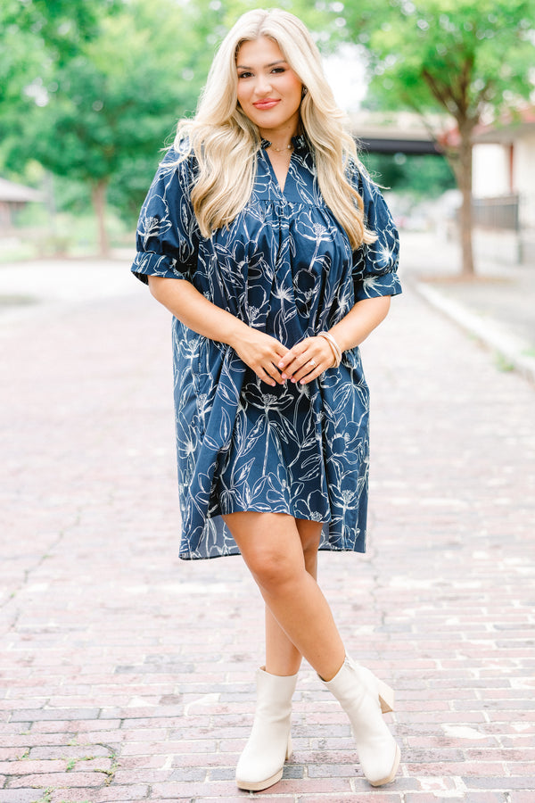Chic Soul plus size clothing, navy baby doll dress with short sleeves and a white floral pattern throughout 