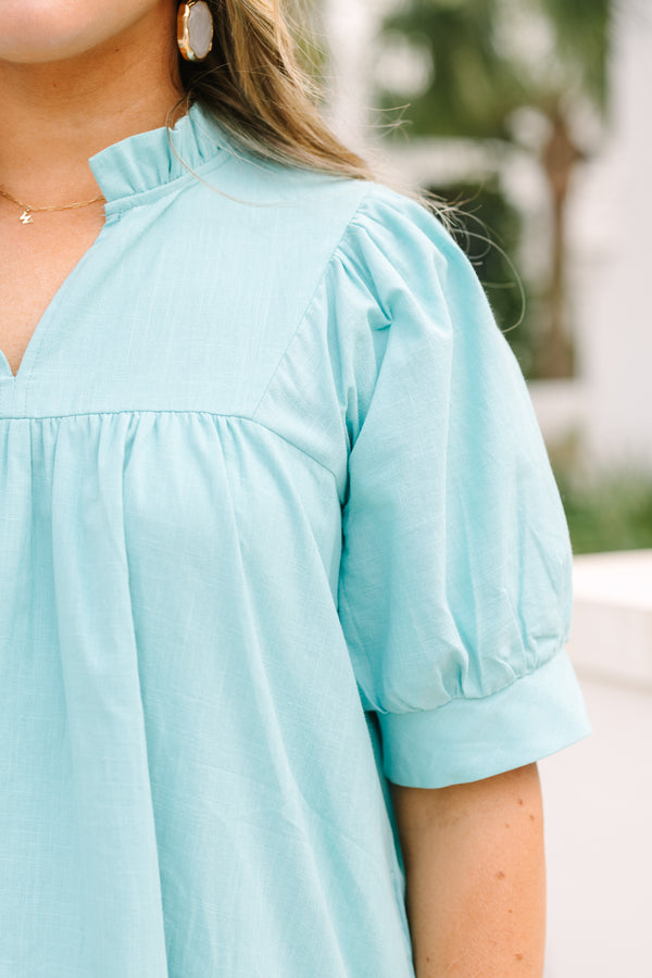 Chic Soul plus size clothing, turquoise knee length dress with puff sleeves that have a cuff a slight v-neckline and eyelet details on the bottom of the dress 