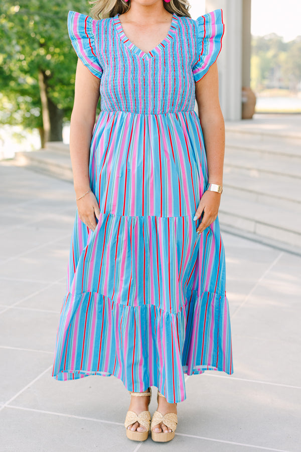 Plus Size blue tiered maxi dress with multi-colored stripes, smocked bodice, and flutter sleeves.