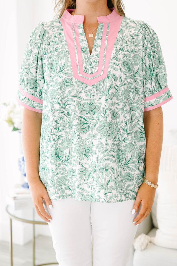 Plus Size green and white floral print top with pink trim, split neckline, and puff sleeves.