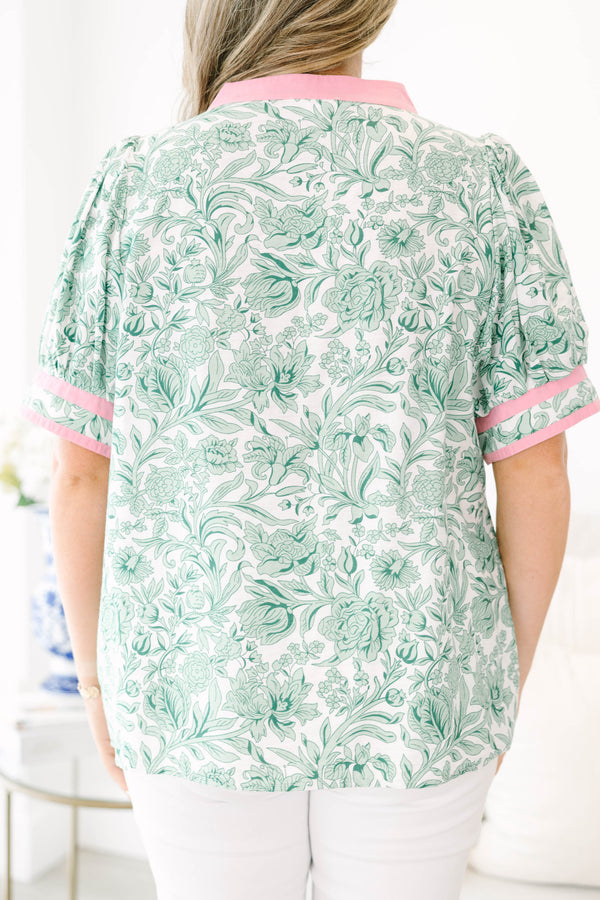 Plus Size green and white floral print top with pink trim, split neckline, and puff sleeves.