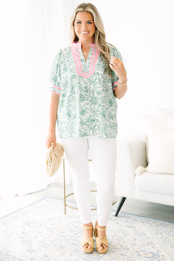 Plus Size green and white floral print top with pink trim, split neckline, and puff sleeves.