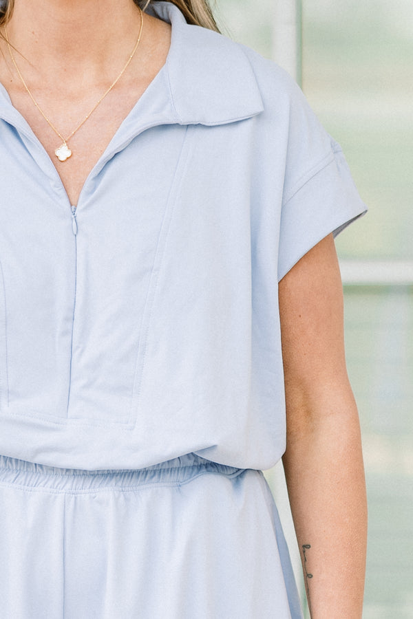 Chic Soul plus size clothing, short-sleeve pastel blue athletic romper with a collar and a zip-up neckline with a smocked waistline 