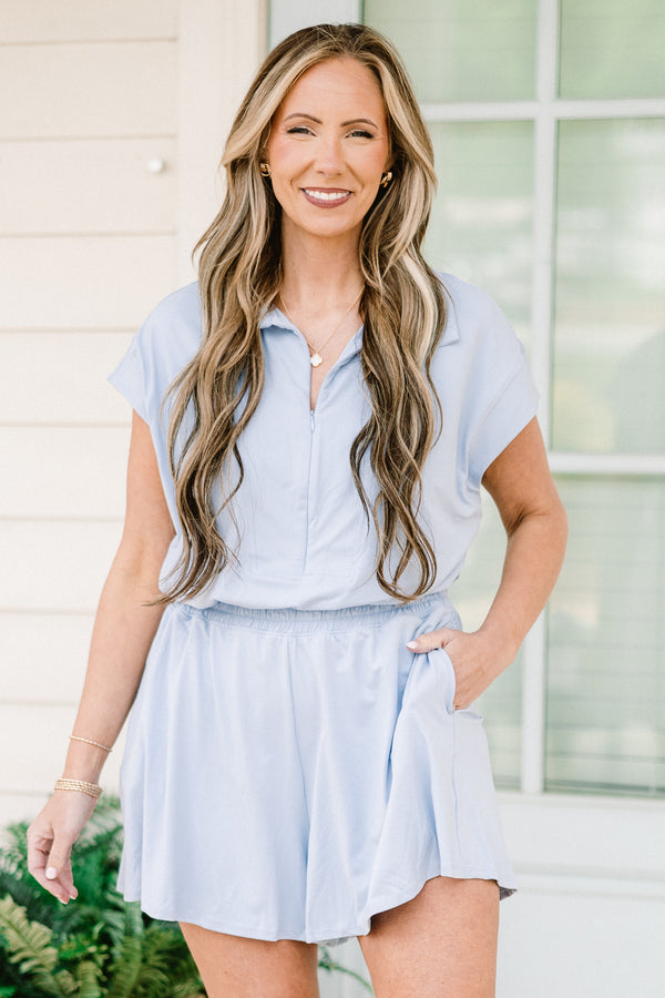 Chic Soul plus size clothing, short-sleeve pastel blue athletic romper with a collar and a zip-up neckline with a smocked waistline 