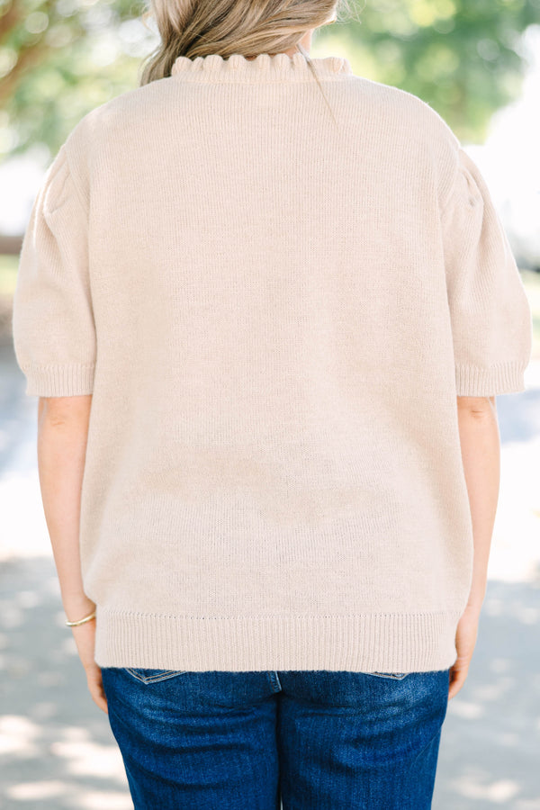 Plus size tan Sweater with short puff sleeves, ruffle neckline, and button details.