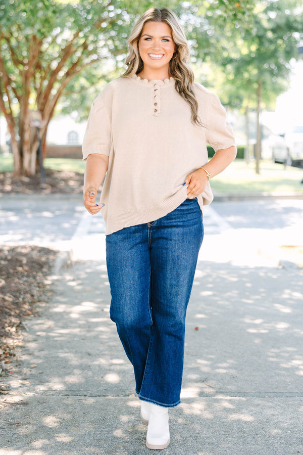 Plus size tan Sweater with short puff sleeves, ruffle neckline, and button details.