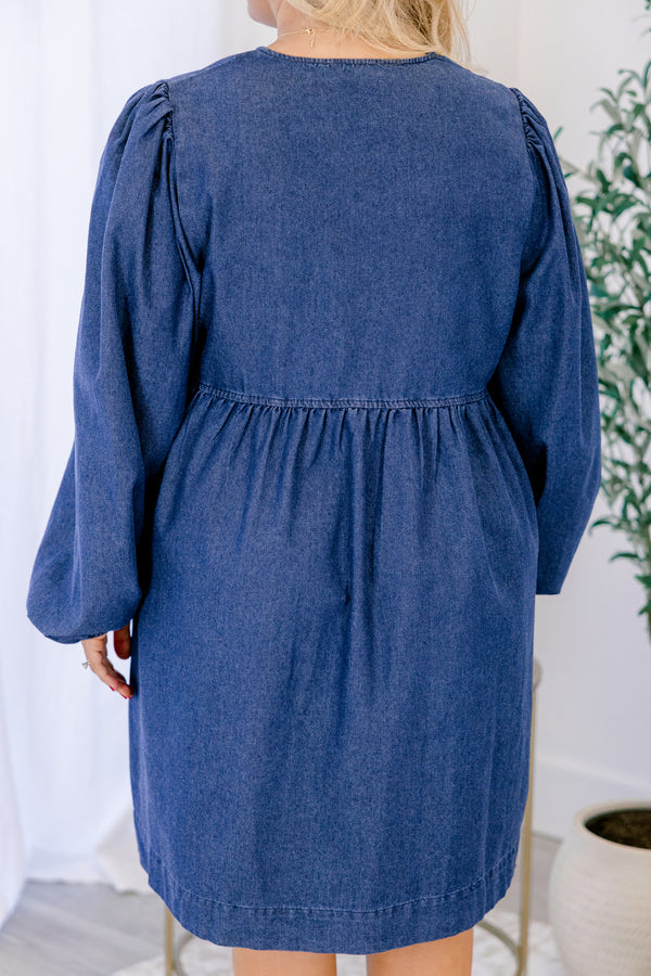 Chic Soul plus size clothing, dark wash denim long puff sleeve knee length baby doll dress with v neck cutout and strings tying in 3 bows down the collar