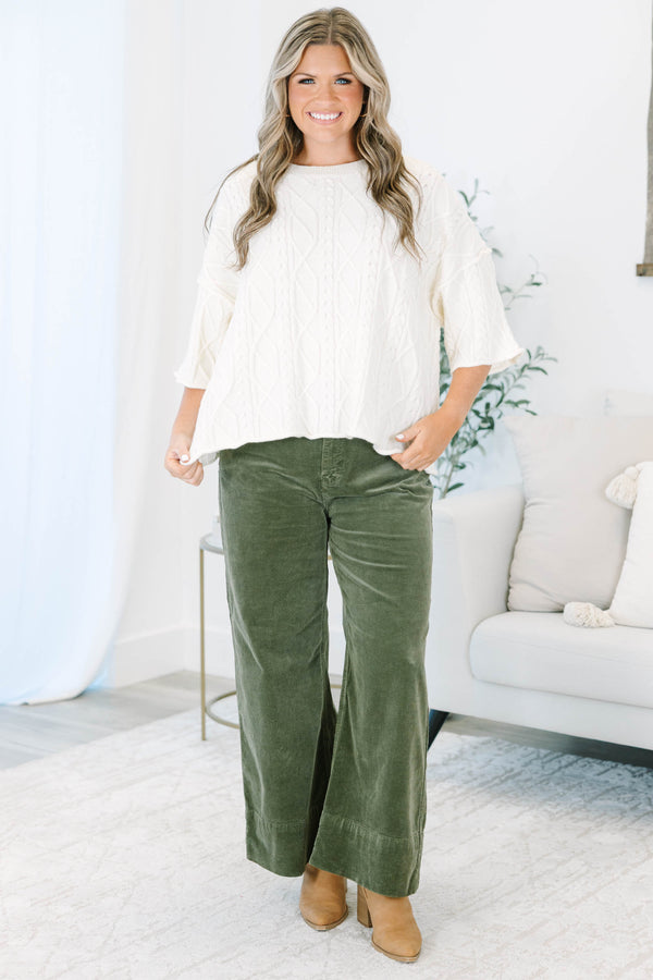 Plus Size moss green wide-leg corduroy pants with a button fly and front pockets.