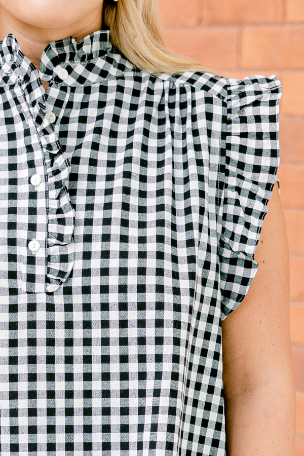 Chic Soul plus size clothing, black gingham top with flutter sleeves and a ruffle detail going down to the chest and on the collar 