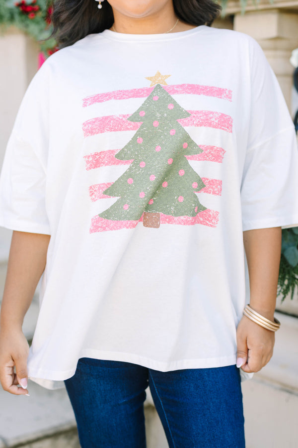 Plus Size white boyfriend tee with a green Christmas tree graphic and pink striped background.