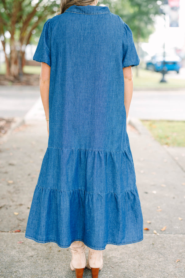 Plus size dark denim tiered maxi dress with a flowy fit, V-neckline, and short puff sleeves.