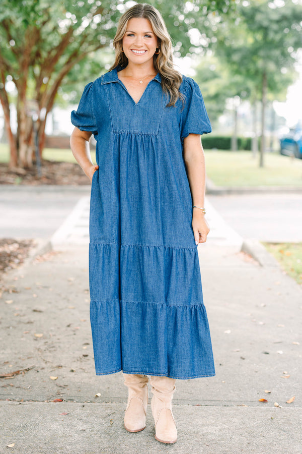 Plus size dark denim tiered maxi dress with a flowy fit, V-neckline, and short puff sleeves.