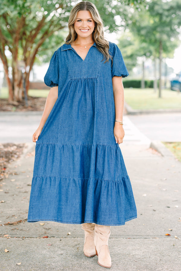 Plus size dark denim tiered maxi dress with a flowy fit, V-neckline, and short puff sleeves.