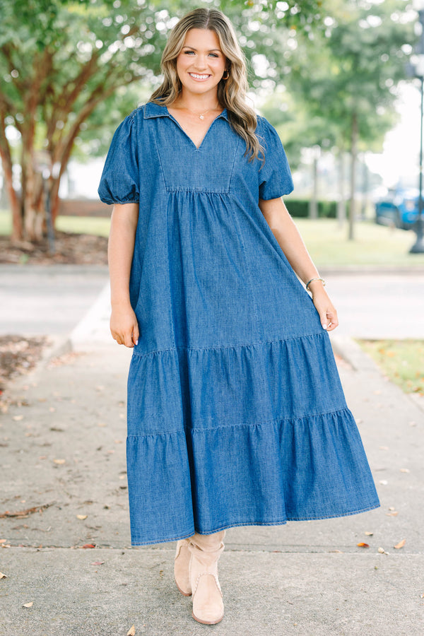 Plus size dark denim tiered maxi dress with a flowy fit, V-neckline, and short puff sleeves.