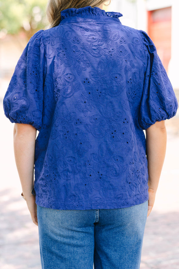 Plus Size navy blue embroidered blouse with puff sleeves and a split neckline.