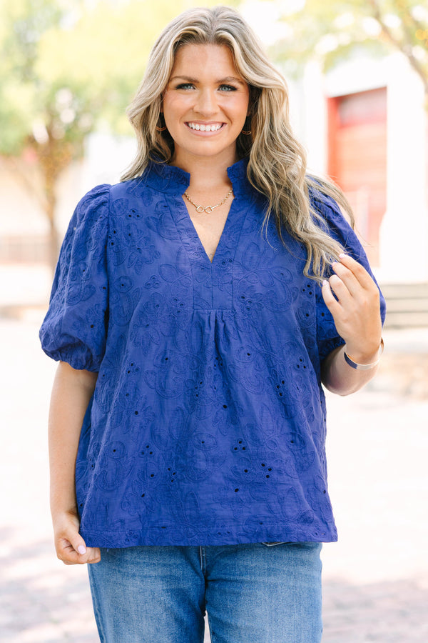 Plus Size navy blue embroidered blouse with puff sleeves and a split neckline.