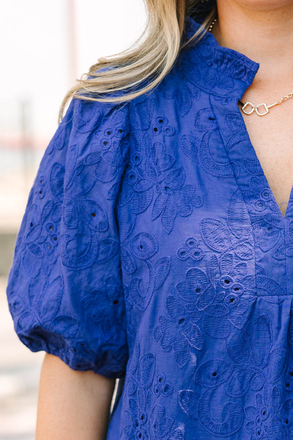 Plus Size navy blue embroidered blouse with puff sleeves and a split neckline.