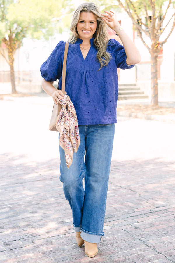 Plus Size navy blue embroidered blouse with puff sleeves and a split neckline.