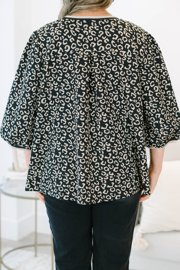 Plus Size leopard jacquard top with elastic puff sleeves, a crew neckline, and a relaxed fit.