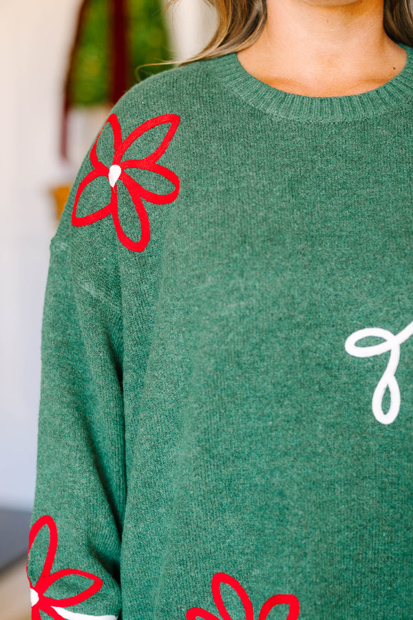Plus size green Memories In The Making Sweater with red floral and white vine embroidery.