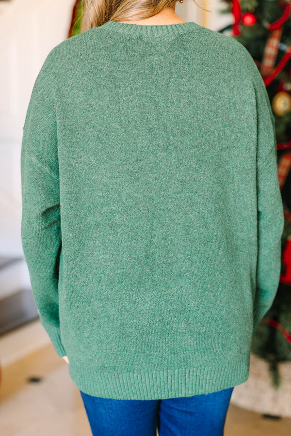 Plus size green Memories In The Making Sweater with red floral and white vine embroidery.