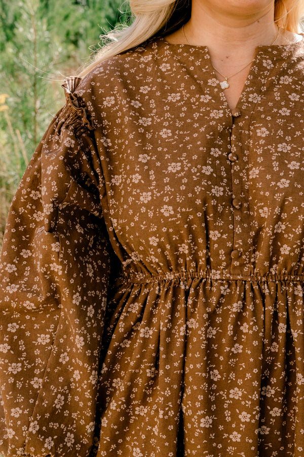 Chic Soul plus size clothing, brown long sleeve flowy maxi dress with small white floral print and cinched at the waist and ends of the sleeves and with a v-cutout on the neck