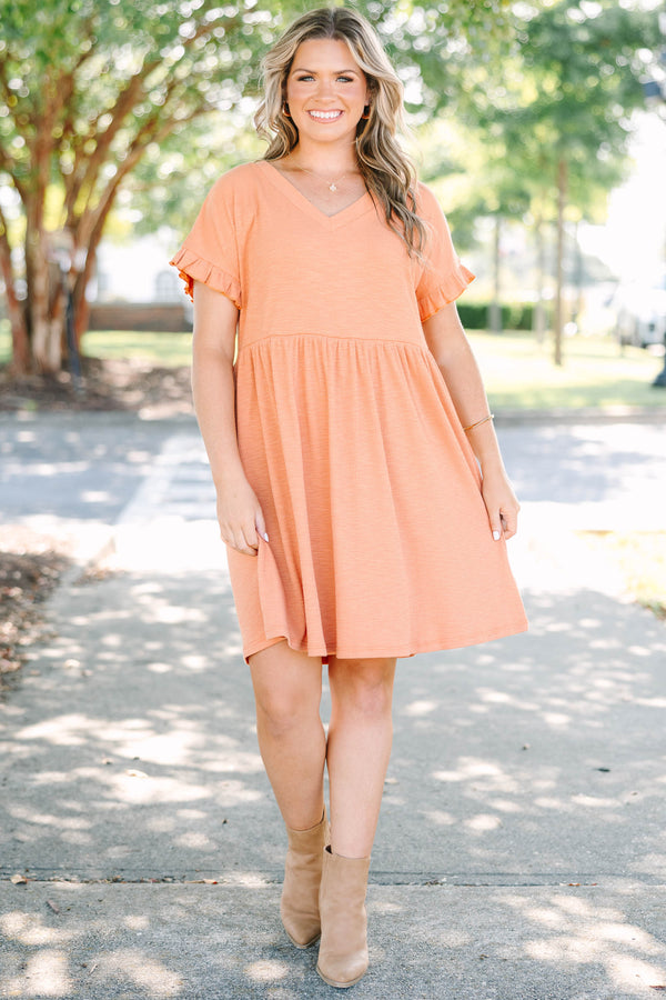 Plus size marmalade orange dress with a flowy babydoll fit, V-neckline, and ruffle sleeve details.