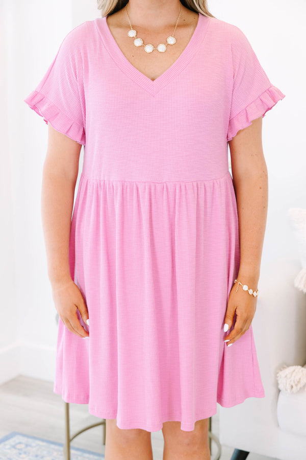 Plus Size pink textured v-neck dress with short ruffle sleeves and a tiered skirt.