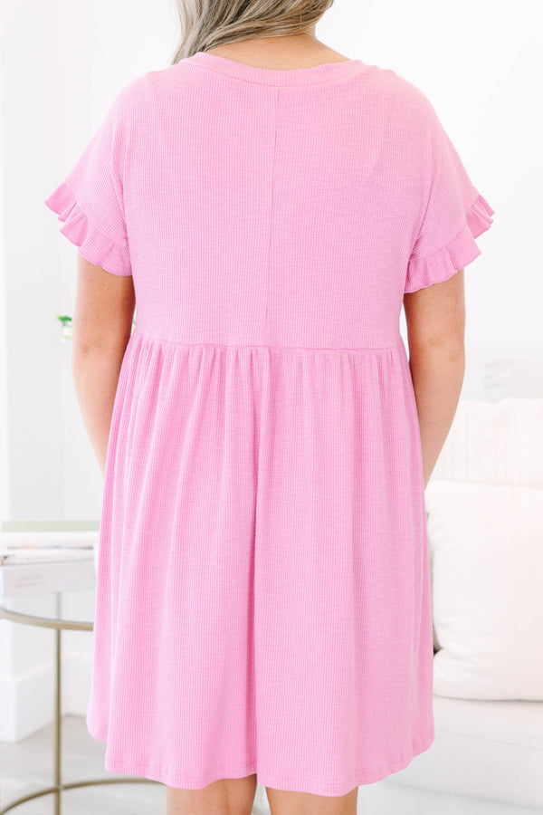 Plus Size pink textured v-neck dress with short ruffle sleeves and a tiered skirt.