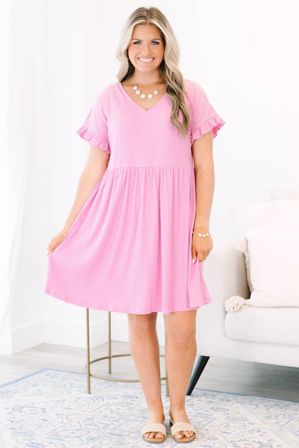 Plus Size pink textured v-neck dress with short ruffle sleeves and a tiered skirt.